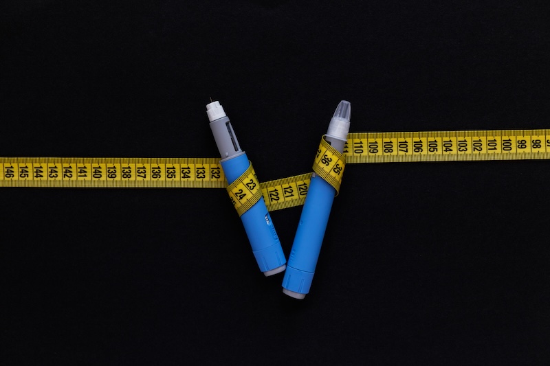 Ozympec sprutor med måttband runt